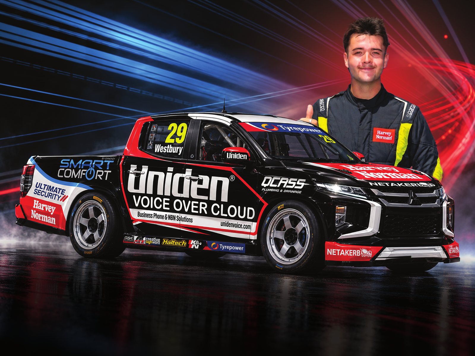 Jack Westbury giving a thumbs up beside the #29 Uniden Voice Over Cloud V8 SuperUte