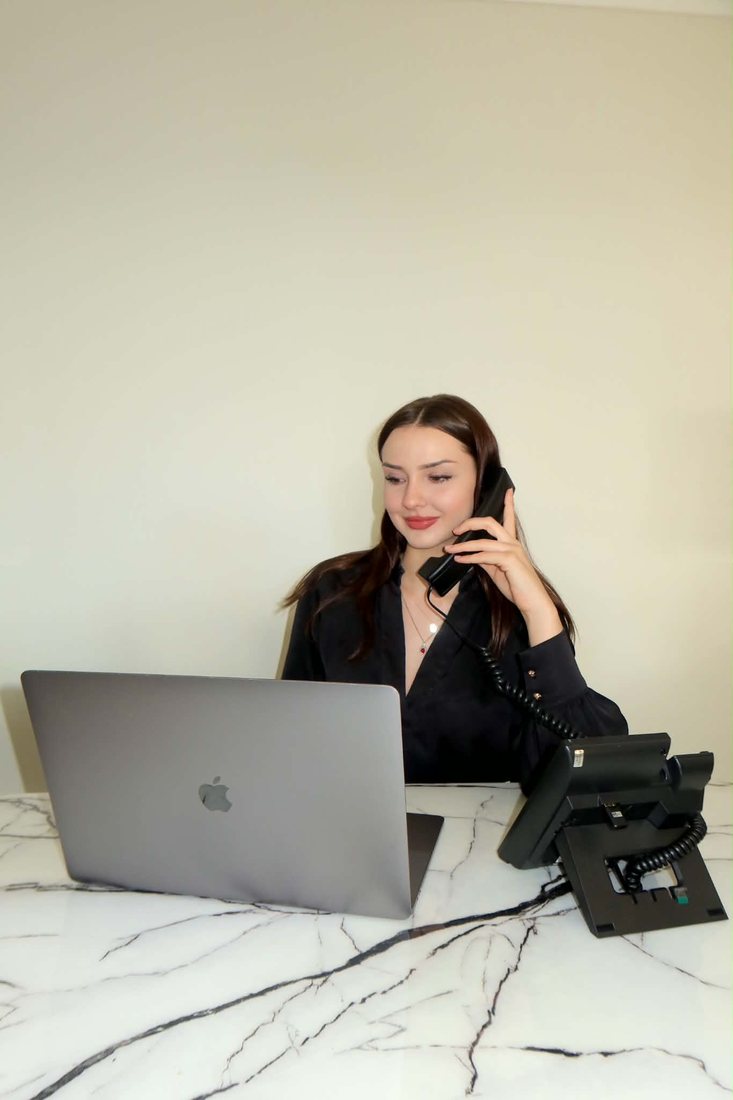 An Imperial Realtor Group team member on the Uniden desk phone
