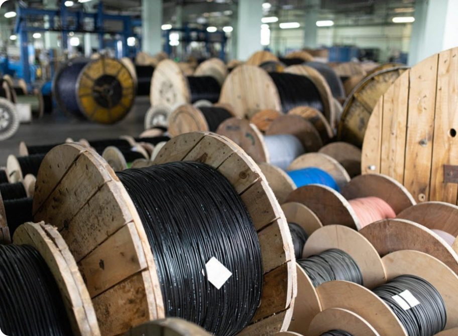 Drums of optical fibre and copper cable in an OSA distribution warehouse